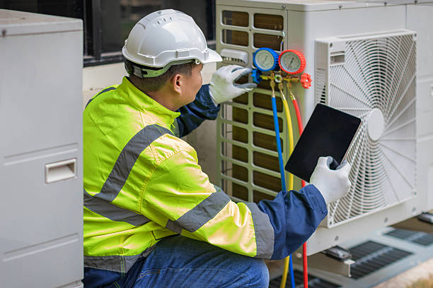 Professional Heat Pump Repair technician working in Point Clear, AL